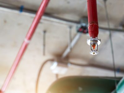 Close-up fire sprinkler on the ceiling.