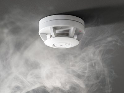 3d rendering smoke detector on ceiling activate by smoke